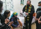 Fr. Larry Barnett with Granny MaHong, seated wearing head scarf